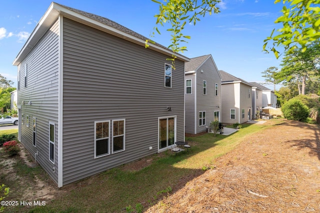 761 Cypress Village Pl, Wilmington, NC 28412 - rear view of house with a yard