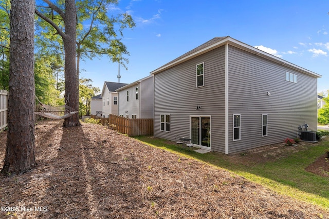 761 Cypress Village Pl, Wilmington, NC 28412 - rear view of house featuring central AC and fence