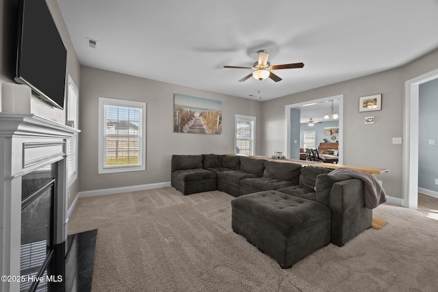506 White Shoal Way, Sneads Ferry, NC 28460 - living area featuring baseboards, a fireplace with flush hearth, carpet, and ceiling fan