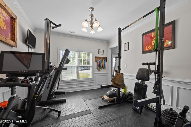506 White Shoal Way, Sneads Ferry, NC 28460 - workout room with crown molding, wainscoting, a chandelier, and visible vents