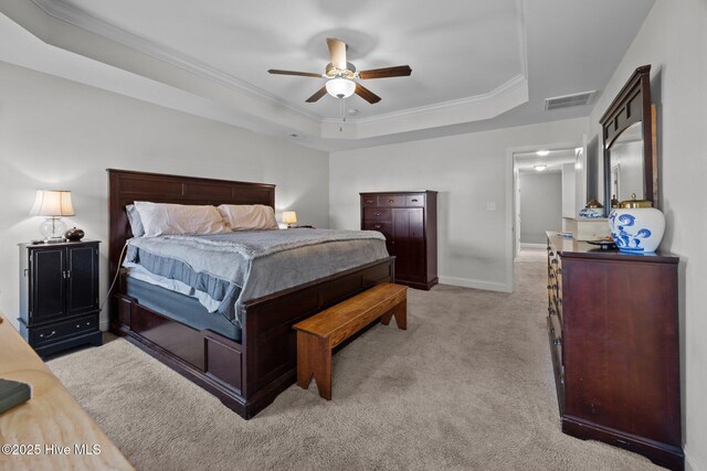 506 White Shoal Way, Sneads Ferry, NC 28460 - bedroom featuring ornamental molding, a tray ceiling, light colored carpet, and visible vents
