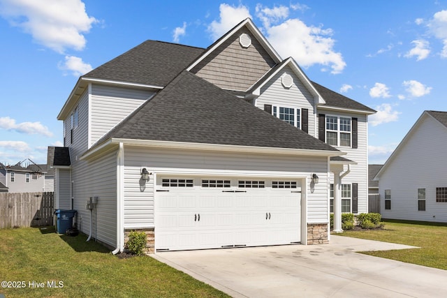 506 White Shoal Way, Sneads Ferry, NC 28460 - view of front of property with a garage, a front yard, stone siding, roof with shingles, and concrete driveway