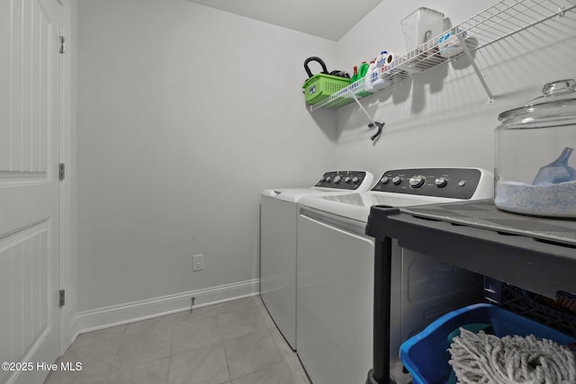 506 White Shoal Way, Sneads Ferry, NC 28460 - clothes washing area with independent washer and dryer, light tile patterned floors, laundry area, and baseboards