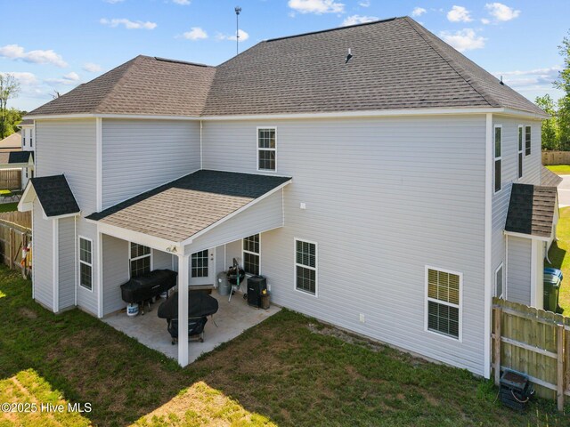 506 White Shoal Way, Sneads Ferry, NC 28460 - rear view of property with fence, a yard, a patio area, and roof with shingles
