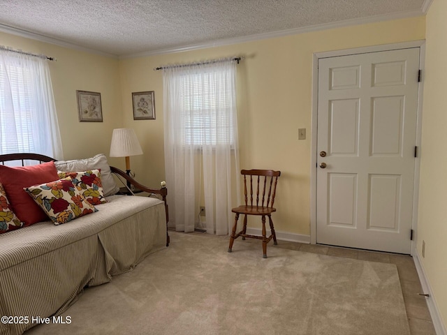 bedroom with crown molding, a textured ceiling, and multiple windows