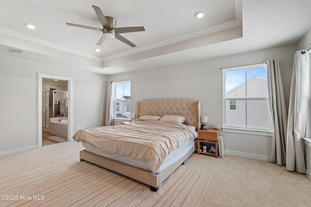 bedroom with recessed lighting, visible vents, baseboards, and a raised ceiling