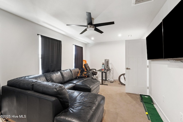 living room with visible vents, ceiling fan, recessed lighting, and light colored carpet