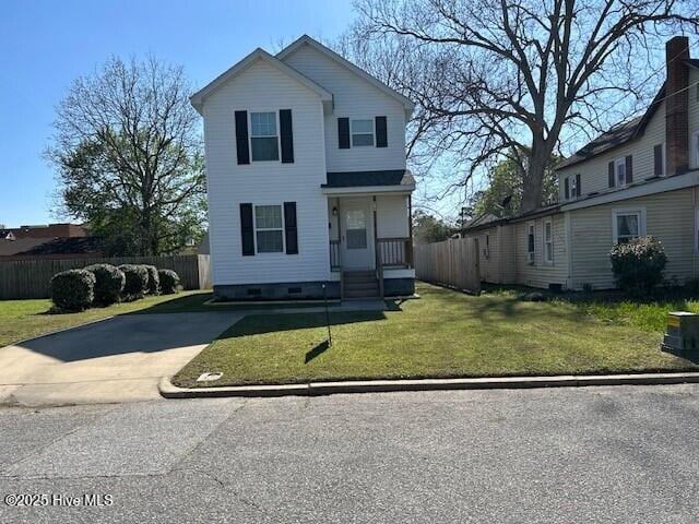409 E Broad St, Elizabeth City, NC 27909 - traditional-style house with crawl space, concrete driveway, a front yard, and fence
