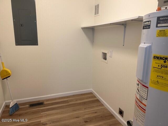 409 E Broad St, Elizabeth City, NC 27909 - laundry area featuring electric water heater, electric dryer hookup, electric panel, visible vents, and laundry area