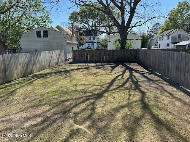 409 E Broad St, Elizabeth City, NC 27909 - view of yard with a fenced backyard and a residential view
