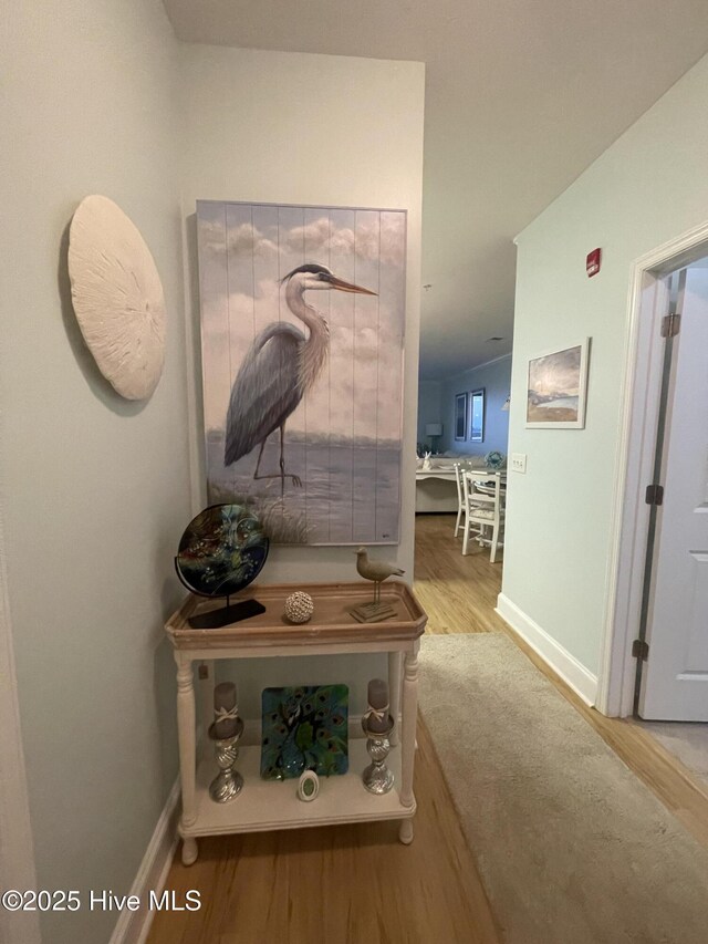 7265 Seashell Ln SW Unit 303, Ocean Isle Beach, NC 28469 - living room with ornamental molding, a ceiling fan, wood finished floors, and baseboards