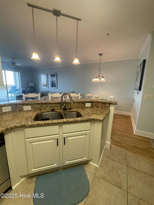 7265 Seashell Ln SW Unit 303, Ocean Isle Beach, NC 28469 - living room featuring dark wood-type flooring, crown molding, and baseboards