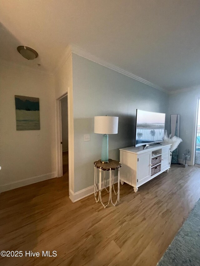 7265 Seashell Ln SW Unit 303, Ocean Isle Beach, NC 28469 - sitting room with baseboards and wood finished floors