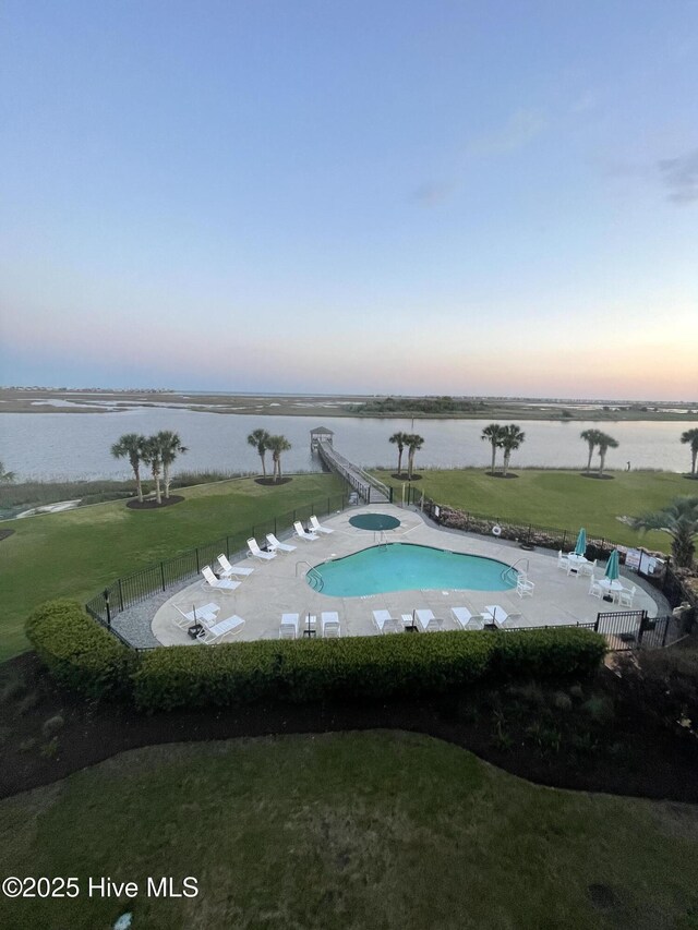 7265 Seashell Ln SW Unit 303, Ocean Isle Beach, NC 28469 - community pool featuring a water view and a patio area
