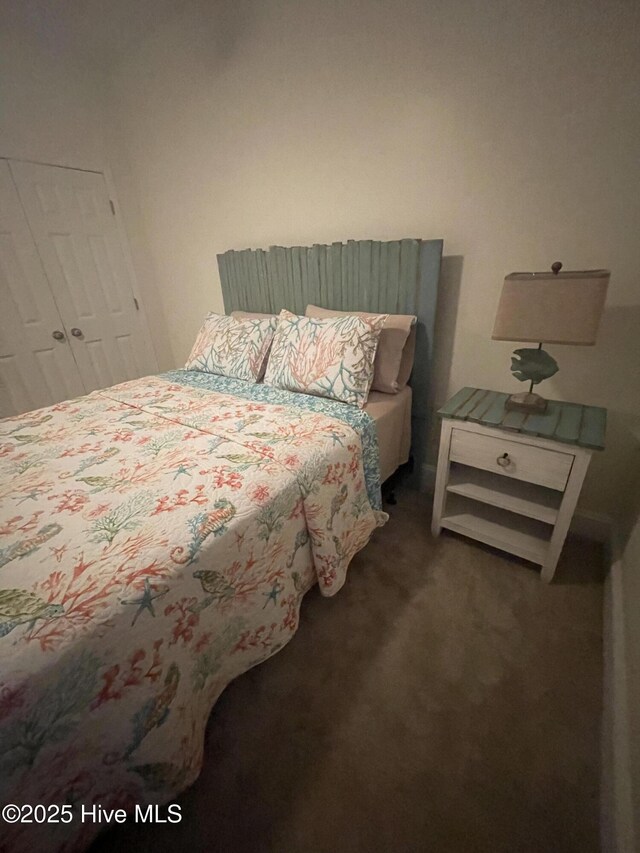 7265 Seashell Ln SW Unit 303, Ocean Isle Beach, NC 28469 - bathroom featuring toilet, tile patterned floors, vanity, and a shower with shower curtain