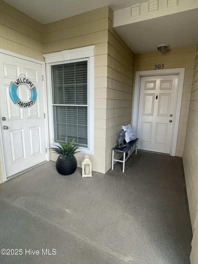 7265 Seashell Ln SW Unit 303, Ocean Isle Beach, NC 28469 - kitchen featuring stainless steel appliances, white cabinets, and baseboards