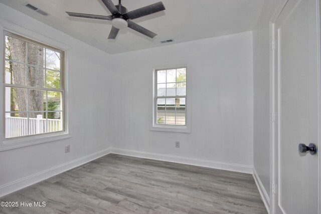 504 Belmont Ave SW, Wilson, NC 27893 - empty room featuring visible vents, baseboards, and wood finished floors