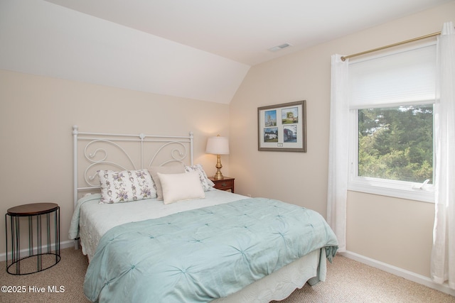 101 Beaufort Walk, Beaufort, NC 28516 - carpeted bedroom with baseboards, vaulted ceiling, and visible vents