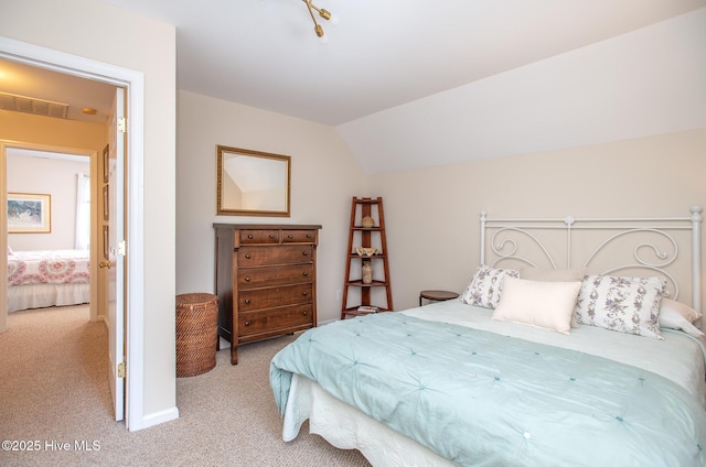 101 Beaufort Walk, Beaufort, NC 28516 - bedroom featuring visible vents, vaulted ceiling, and light carpet