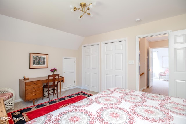 101 Beaufort Walk, Beaufort, NC 28516 - carpeted bedroom featuring two closets, baseboards, and vaulted ceiling