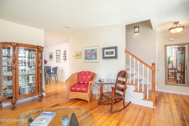 101 Beaufort Walk, Beaufort, NC 28516 - living area with light wood finished floors, baseboards, and stairs