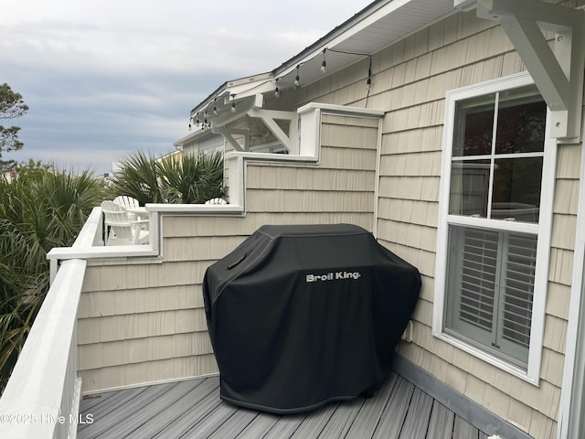 wooden deck with grilling area