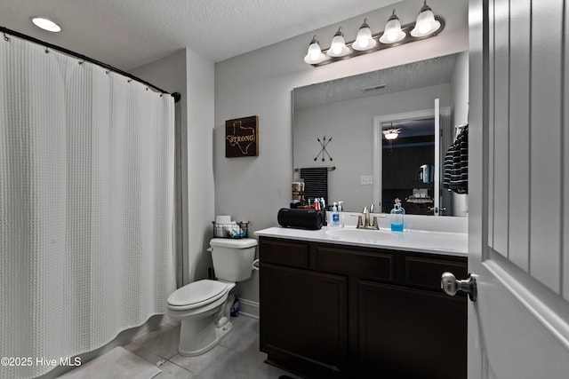 full bath with vanity, curtained shower, tile patterned flooring, a textured ceiling, and toilet