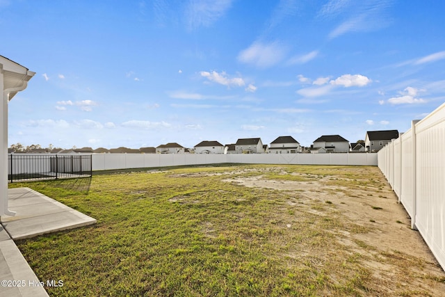 view of yard with a fenced backyard
