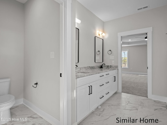 295 E Ivybridge Dr, Hubert, NC 28539 - full bath with marble look tiles, double vanity, a ceiling fan, and recessed lighting