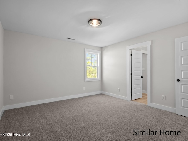 295 E Ivybridge Dr, Hubert, NC 28539 - unfurnished bedroom with carpet and baseboards