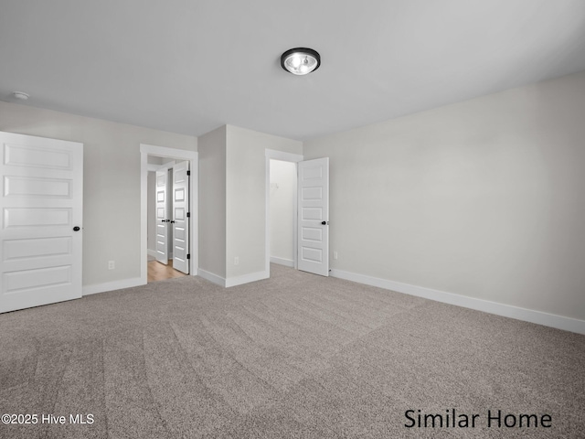 295 E Ivybridge Dr, Hubert, NC 28539 - unfurnished bedroom with carpet flooring and baseboards