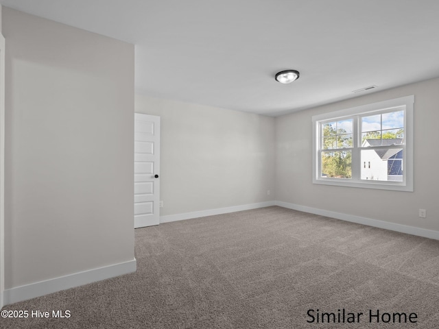 295 E Ivybridge Dr, Hubert, NC 28539 - spare room featuring carpet and baseboards