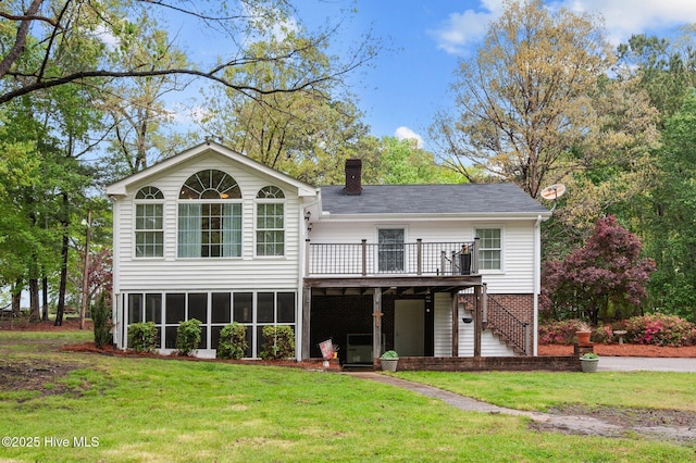 379 Greenbrier Rd, Tarboro, NC 27886 - rear view of house with a yard, a wooden deck, stairway, and a chimney