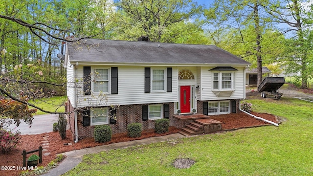 379 Greenbrier Rd, Tarboro, NC 27886 - bi-level home featuring a chimney, a front yard, and brick siding