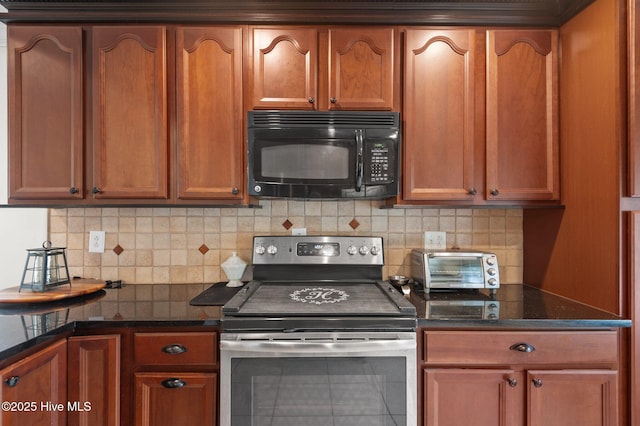 379 Greenbrier Rd, Tarboro, NC 27886 - kitchen with dark stone countertops, black microwave, stainless steel electric range oven, and decorative backsplash