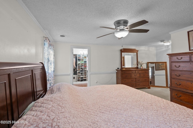 379 Greenbrier Rd, Tarboro, NC 27886 - bedroom with ornamental molding, a ceiling fan, and a textured ceiling