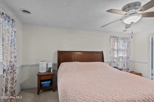 379 Greenbrier Rd, Tarboro, NC 27886 - bedroom featuring light carpet, visible vents, a textured ceiling, and crown molding