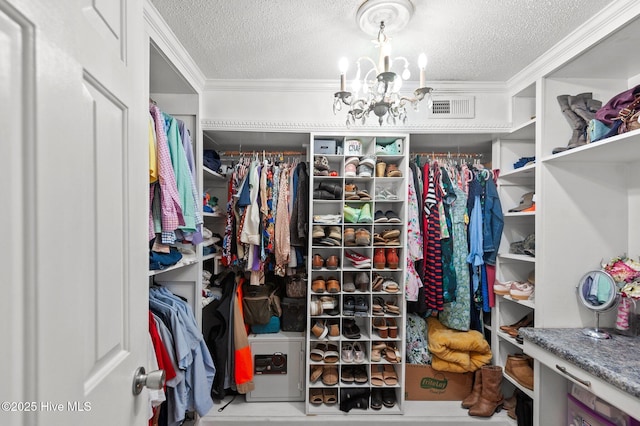379 Greenbrier Rd, Tarboro, NC 27886 - walk in closet featuring a notable chandelier and visible vents