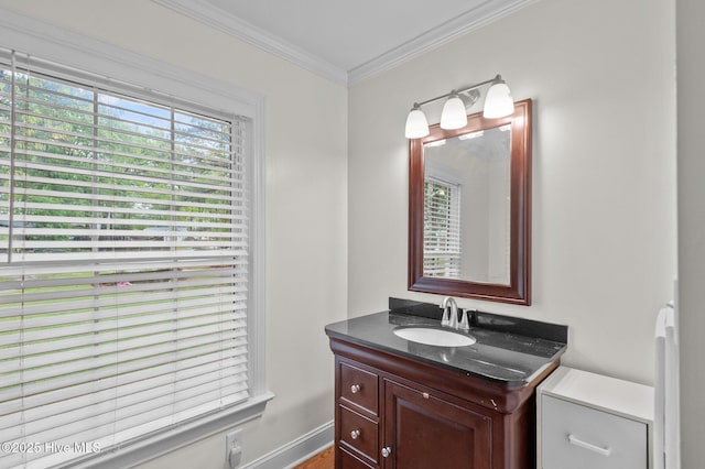 379 Greenbrier Rd, Tarboro, NC 27886 - bathroom with crown molding, baseboards, vanity, and wood finished floors