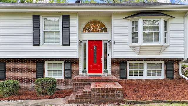 379 Greenbrier Rd, Tarboro, NC 27886 - view of exterior entry featuring brick siding and a shingled roof