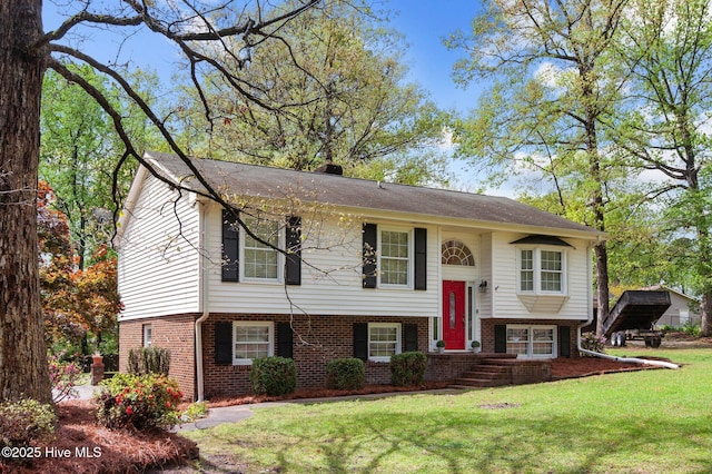 379 Greenbrier Rd, Tarboro, NC 27886 - raised ranch with a front lawn and brick siding