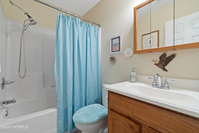 full bath featuring shower / bathtub combination with curtain, vanity, and toilet