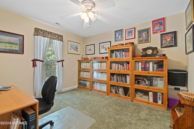office space featuring baseboards, carpet flooring, ceiling fan, and visible vents