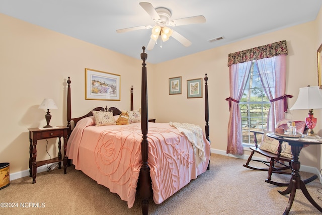 bedroom featuring light carpet, visible vents, and baseboards