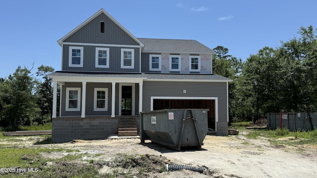 302 E Ivybridge Dr, Hubert, NC 28539 - view of front facade with covered porch, an attached garage, and a shingled roof