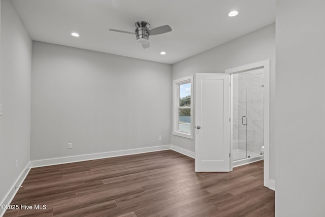 unfurnished bedroom featuring baseboards, dark wood finished floors, and recessed lighting