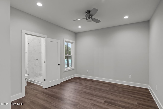 spare room featuring dark wood-style flooring, baseboards, a ceiling fan, and recessed lighting