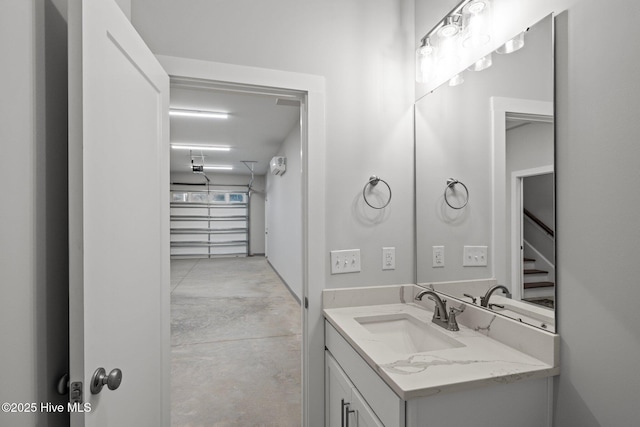 bathroom featuring concrete floors and vanity