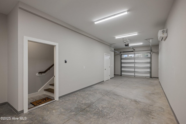 garage with a garage door opener, baseboards, and an AC wall unit