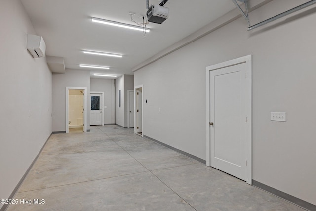 garage featuring a garage door opener, baseboards, and an AC wall unit